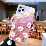 a close up of a person holding a phone with a flower case