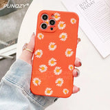a close up of a person holding a phone case with a flower pattern
