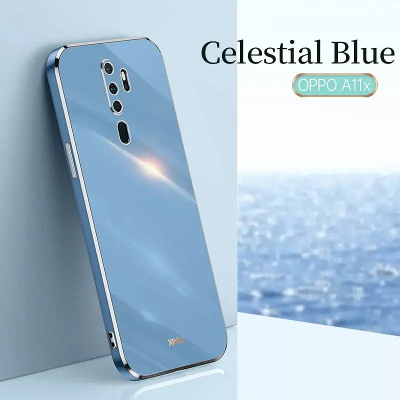 a close up of a phone with a blue background and a picture of the ocean