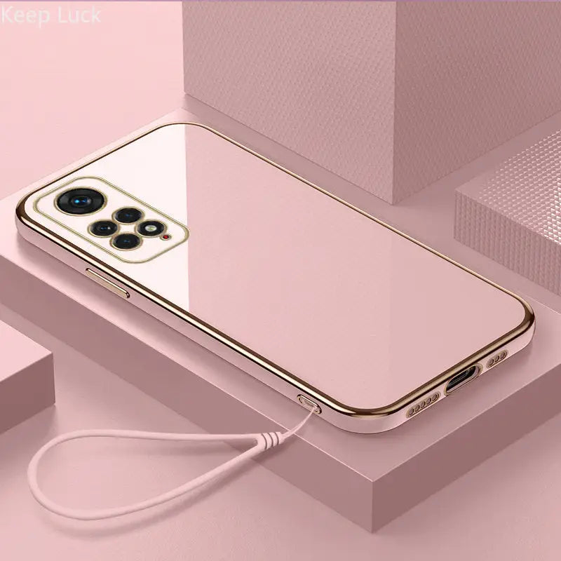 a gold iphone case with a cable attached to it