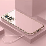 a white iphone with a gold case and earphones