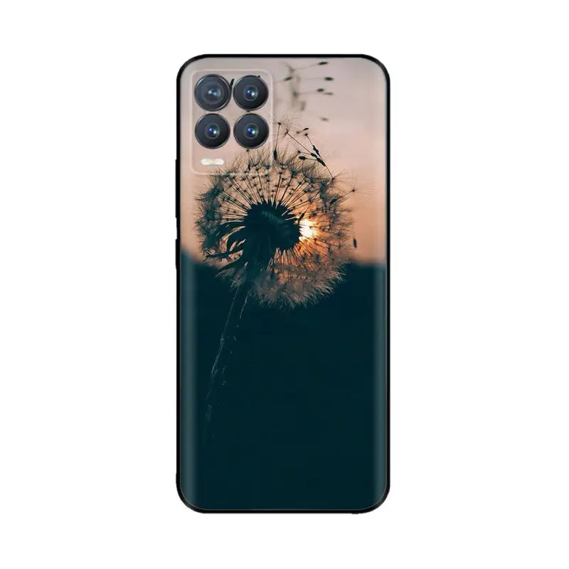 a close up of a phone case with a dandelion in the background