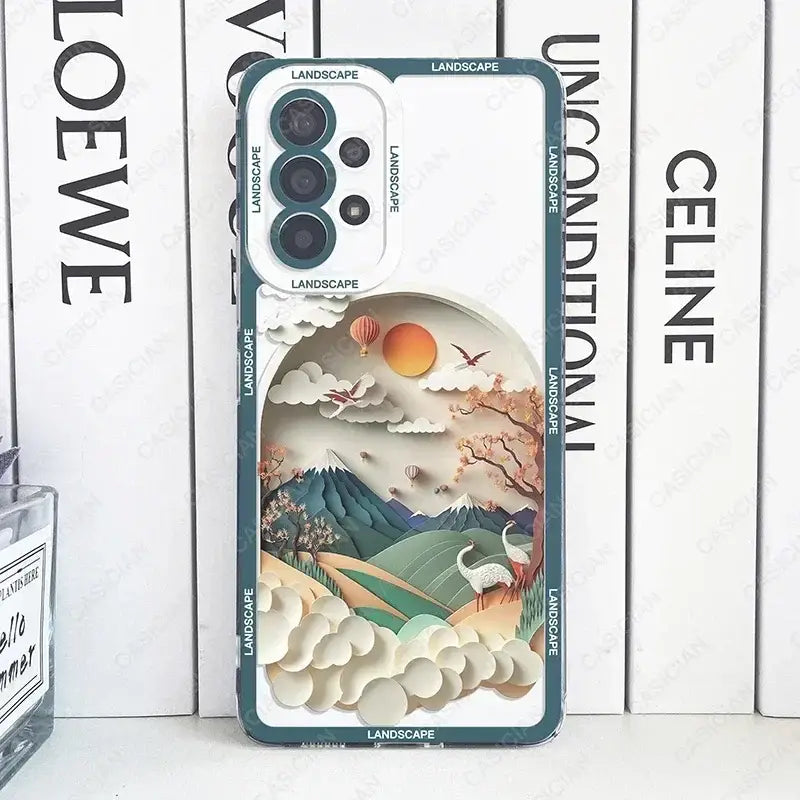 a close up of a phone case with a landscape on it