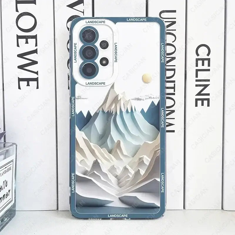 a close up of a phone case with a mountain scene