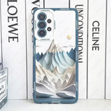 a close up of a phone case with a mountain scene