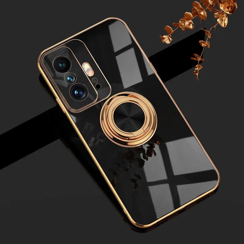 a close up of a phone with a gold ring on it