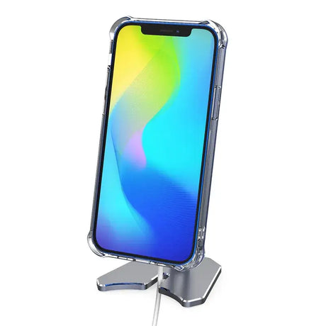 A close up of a phone on a stand with a phone in the background