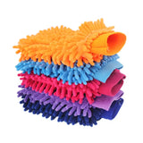 a close up of a pile of colorful cleaning gloves