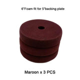 a close up of a pile of maroon colored foam discs