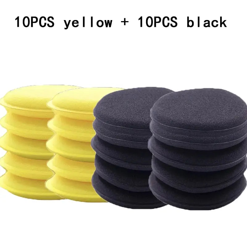 a close up of a pile of yellow and black sponge pads