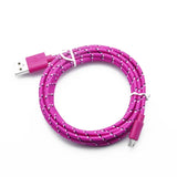 a close up of a pink braided usb cable with a white cord