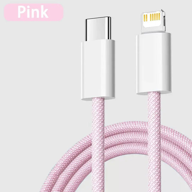 a close up of a pink cable connected to a white phone