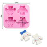 a close up of a pink ice tray with a teddy bear mold