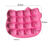 a close up of a pink hello kitty ice tray with a measuring scale