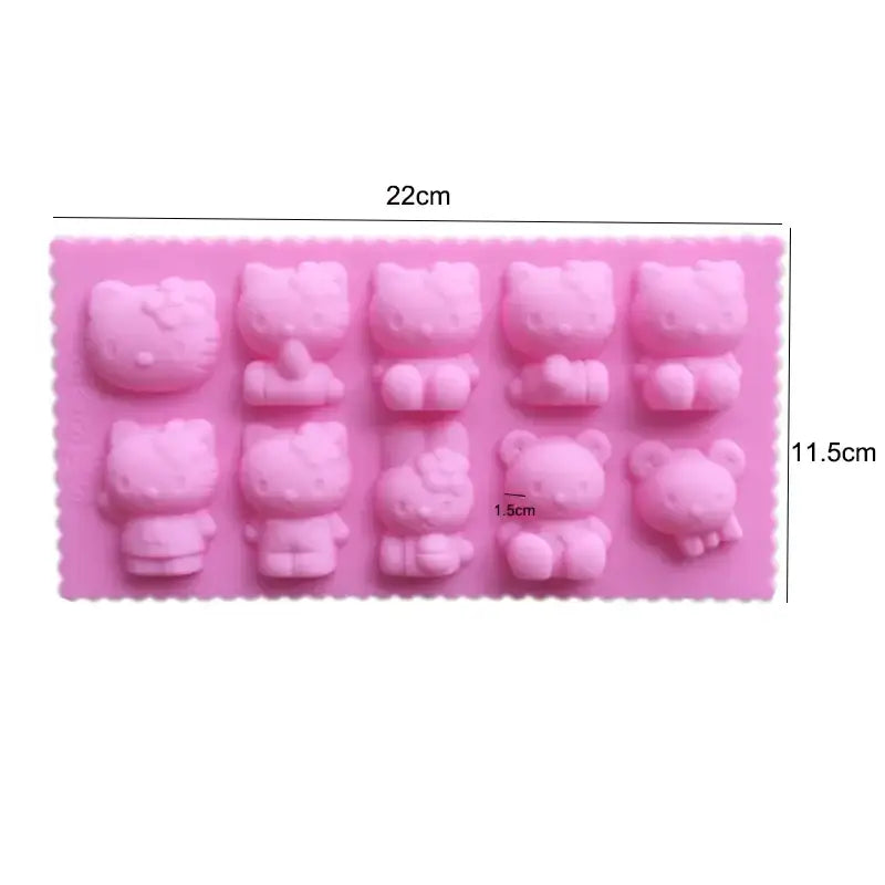 a close up of a pink hello kitty mold with a ruler