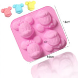 a close up of a pink mold with a number of small teddy bears