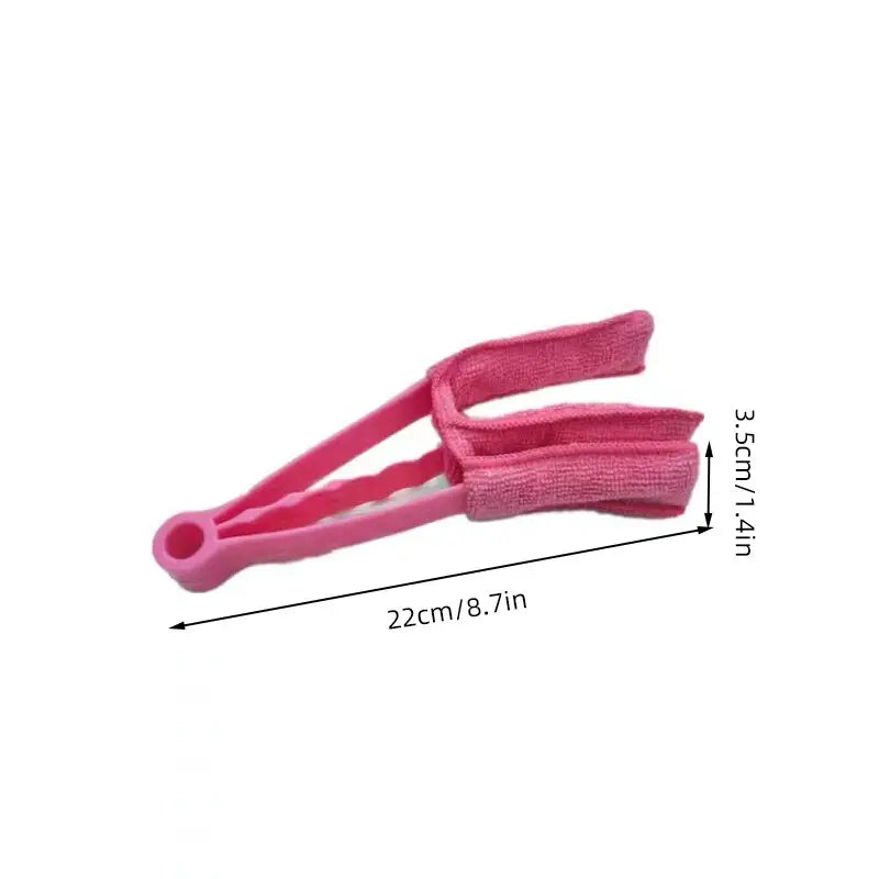 a close up of a pink hair clip with a measuring line