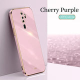 a close up of a pink phone with a cherry purple background