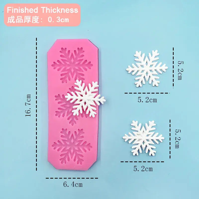 a close up of a pink plastic snowflake with measurements