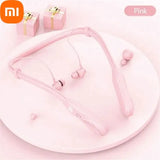 a close up of a pink plate with a pair of earphones