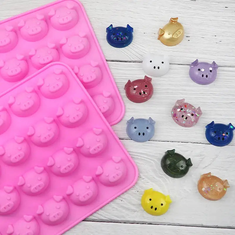 a close up of a pink tray with a bunch of small plastic animals