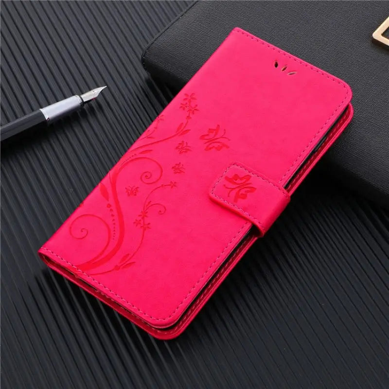 the case is made of leather and has a flower design