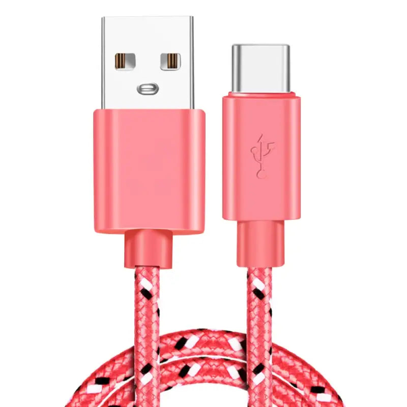 a close up of a pink and white braided usb cable