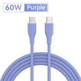 a close up of a purple cable connected to a white wall