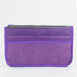 a close up of a purple purse with a zipper