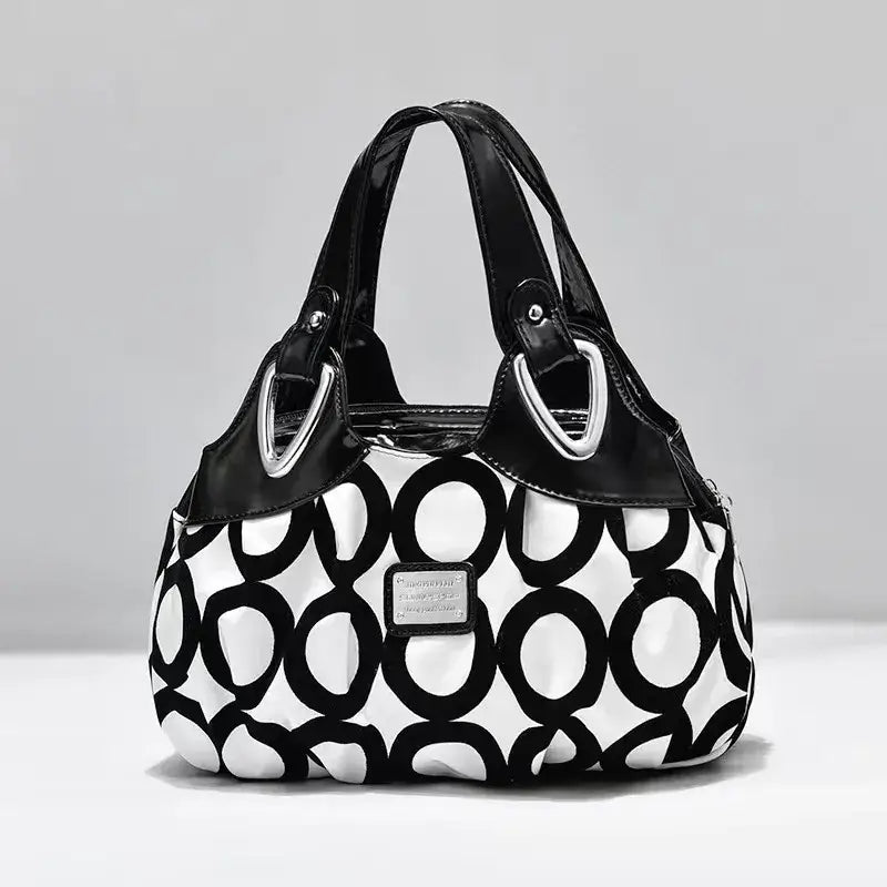 a close up of a purse with a black and white design
