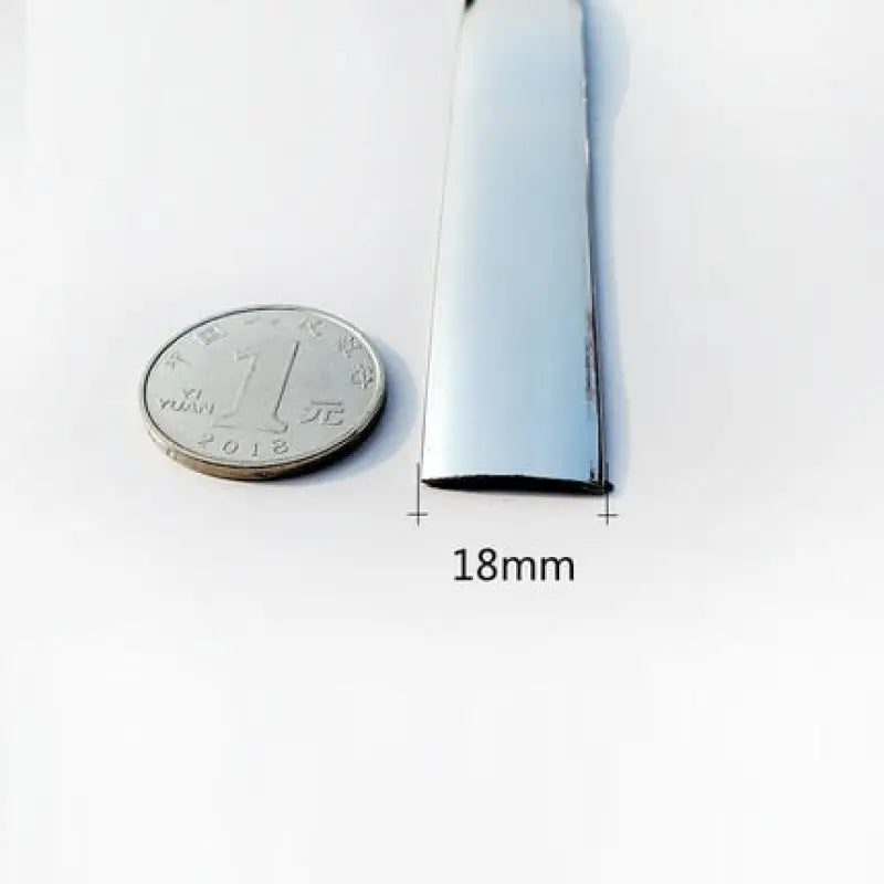 a small silver tube with a small coin