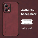 a close up of a red phone with a text underneath it