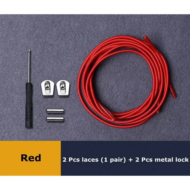 a close up of a red wire and two wires on a table