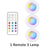 a close up of a remote control and three different colored lights