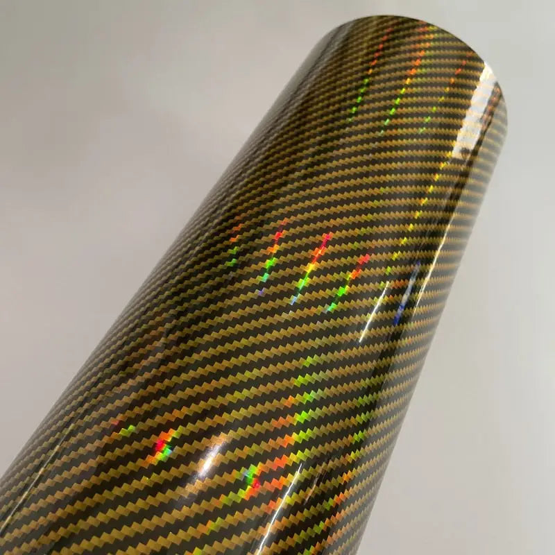 a close up of a roll of black and gold carbon fiber