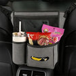 a close up of a car seat with a snack and drink in it