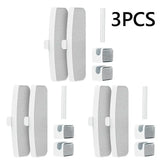 a close up of a set of four white door handles