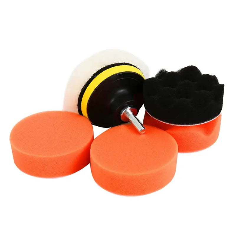 a close up of a set of three orange foaming discs