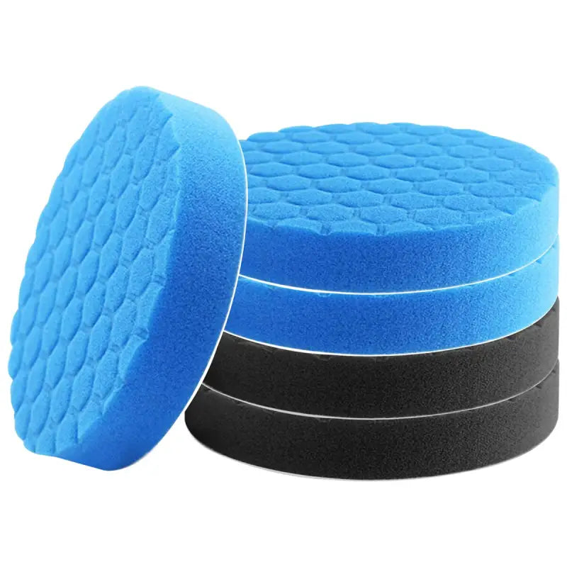 a close up of a stack of blue sponge pads on a white background