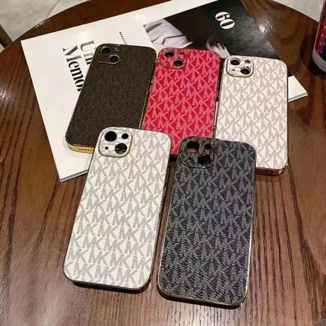 a close up of a table with a bunch of cell phones on it