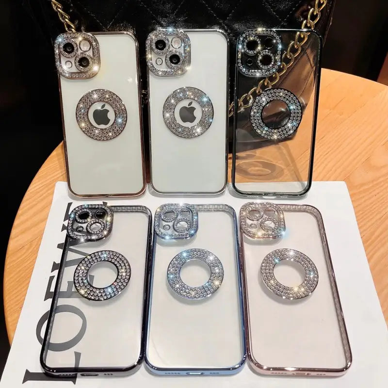 a set of four iphone cases with a diamond ring