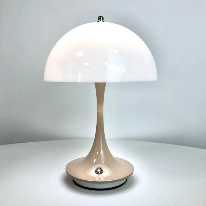 a close up of a table lamp on a white surface