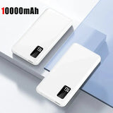 a close up of two white power banks on a table
