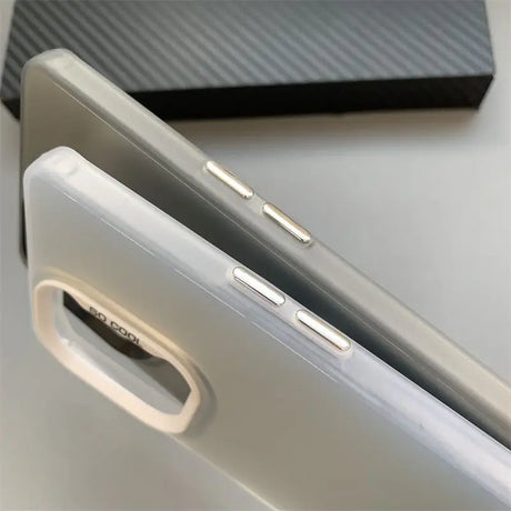 Close-up view of smartphone edges showing volume buttons and charging port.