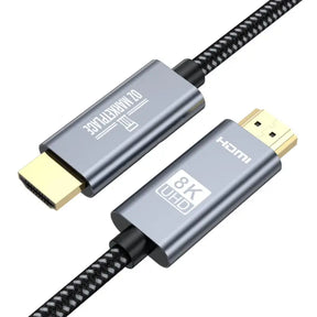 A close up of a usb cable with a black braid