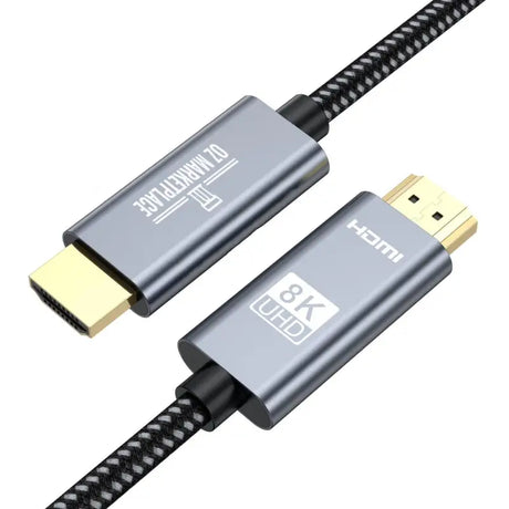 A close up of a usb cable with a black braid