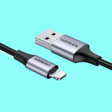 A close up of a usb cable connected to a charger