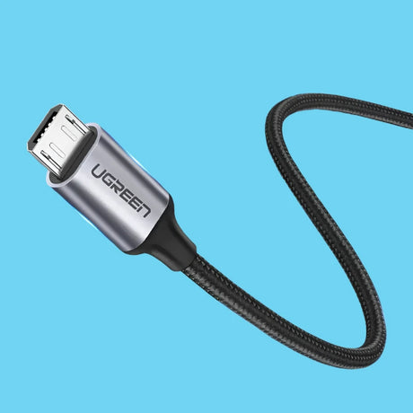 A close up of a usb cable connected to a charger