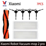 a close up of a vacuum mop and a brush on a white background