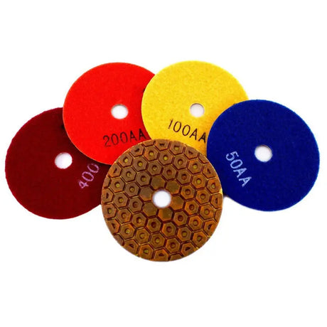 a set of four polish pads with different colors